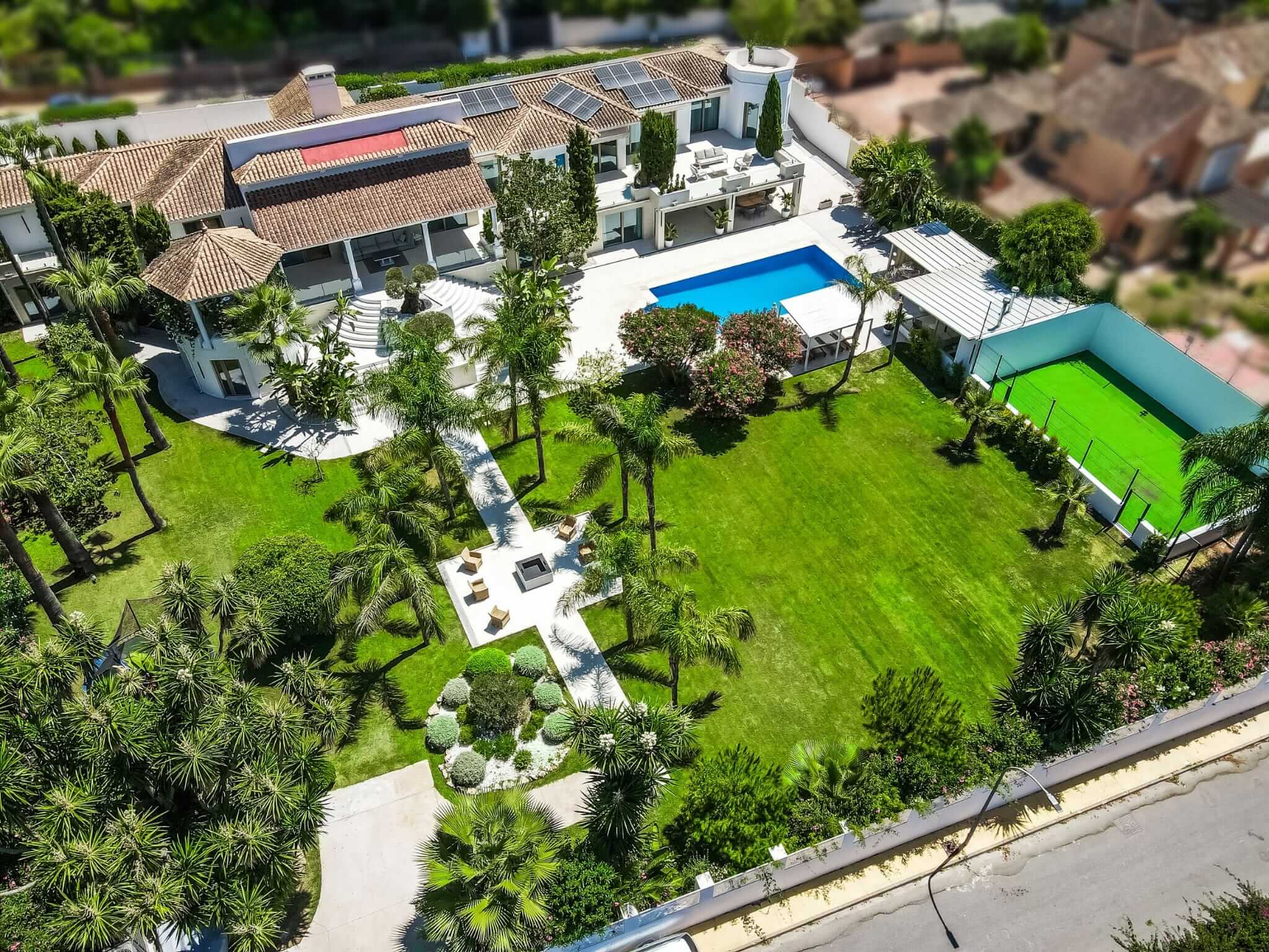 Aerial view of the villa with padel court